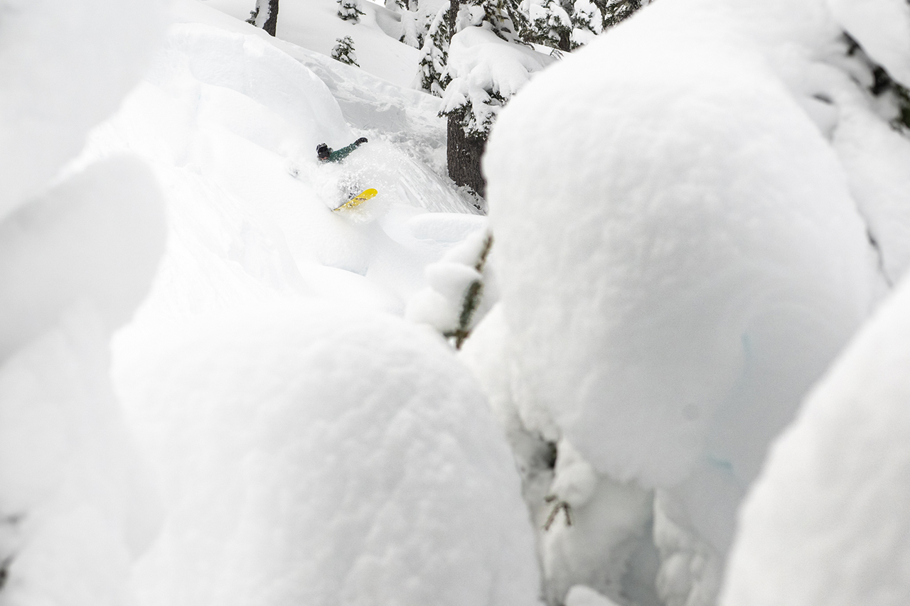 Katie Kennedy snowboarding on her Two Time women's snowboard