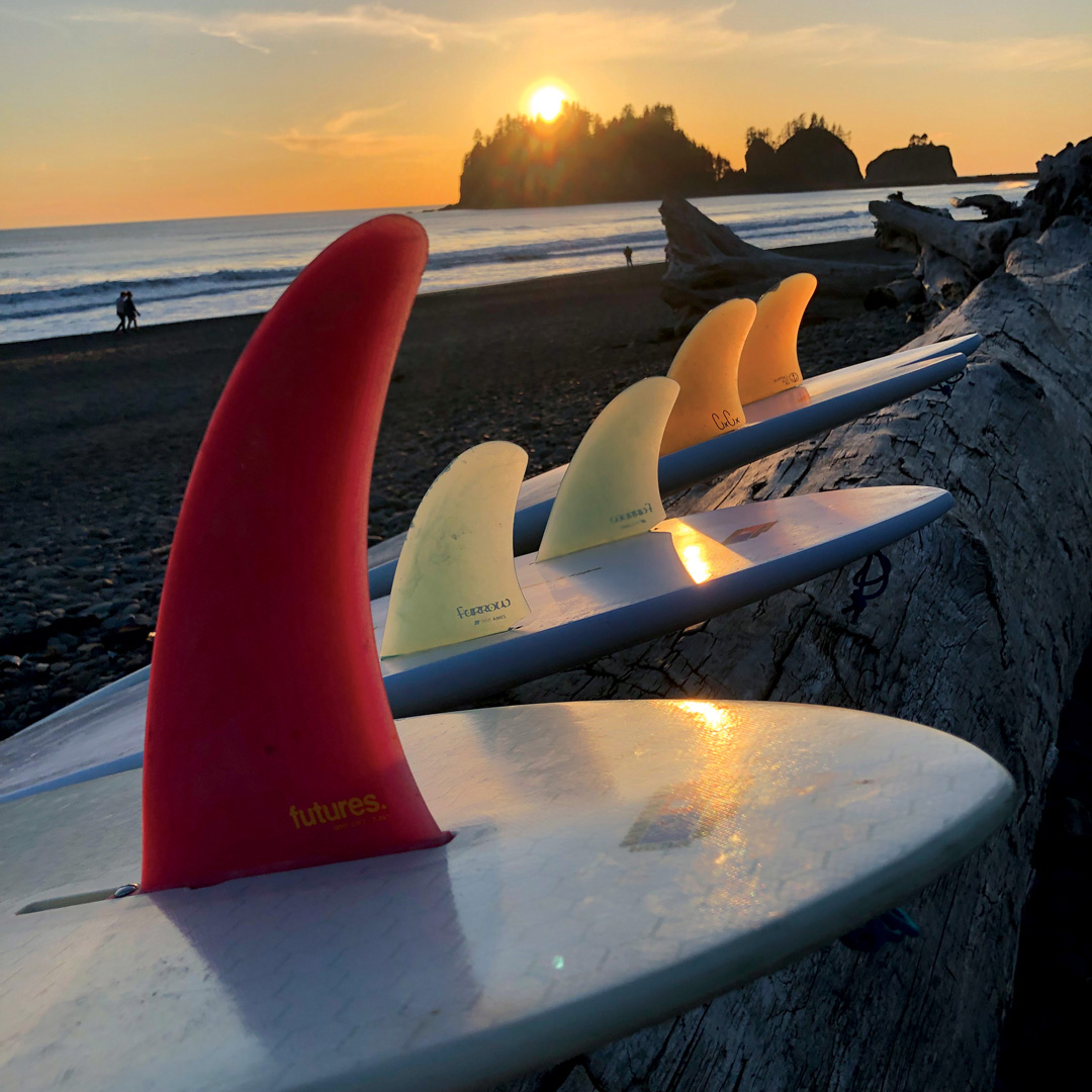 Alex Lopez surfboards at La Push, WA.